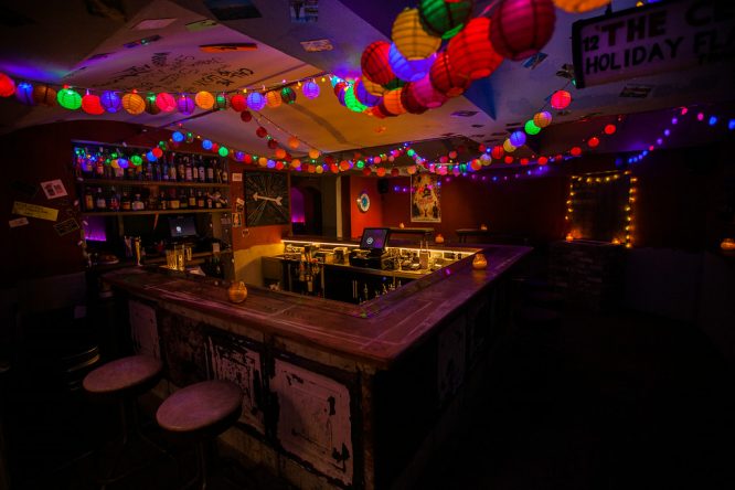 The bright lights of the interior of Call Me Mr Lucky, a secret bar in London