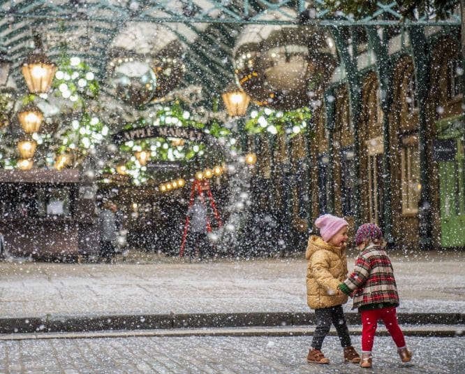 two children playing among the snow at Covent Garden
