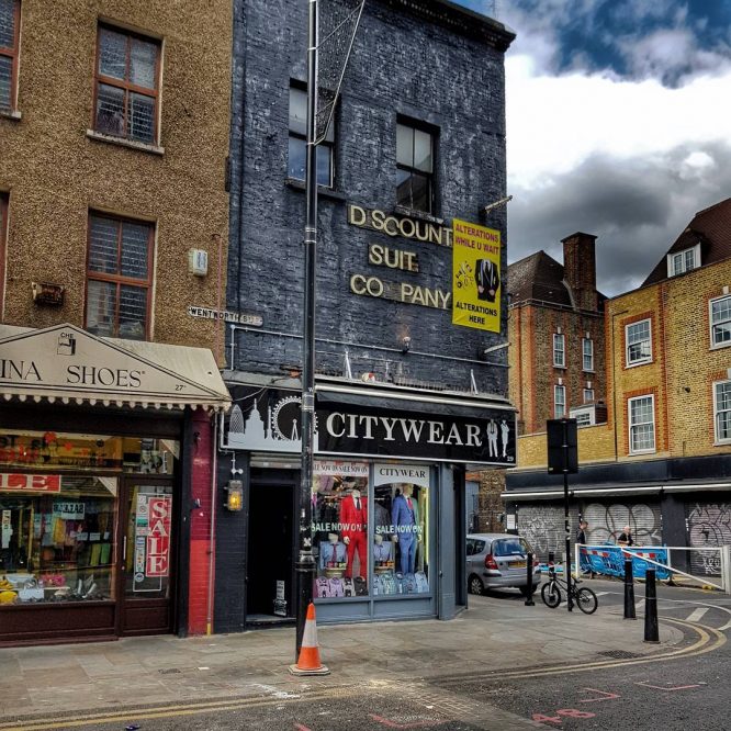 The exterior of the Discount Suit Company in Aldgate, East London